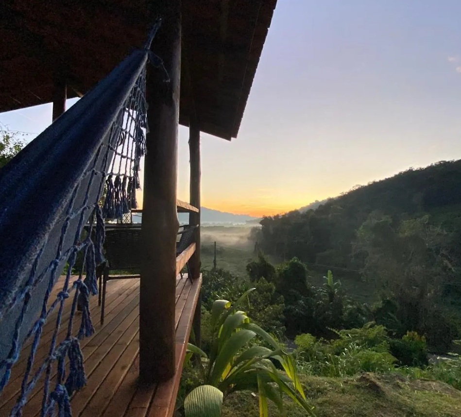 Deck with rattan chairs and bay view
