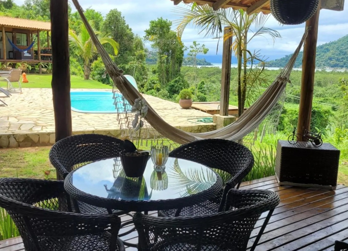 Hammock and pool overlooking Paraty bay